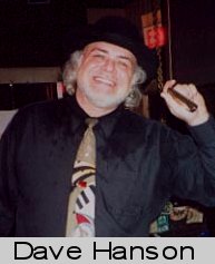 A picture of a smiling Dave Hanson with his harp in hand.
