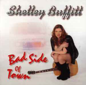 The cover of the CD with Shelley sitting on her guitar.