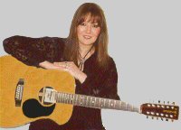 A picture of Marion with her guitar.